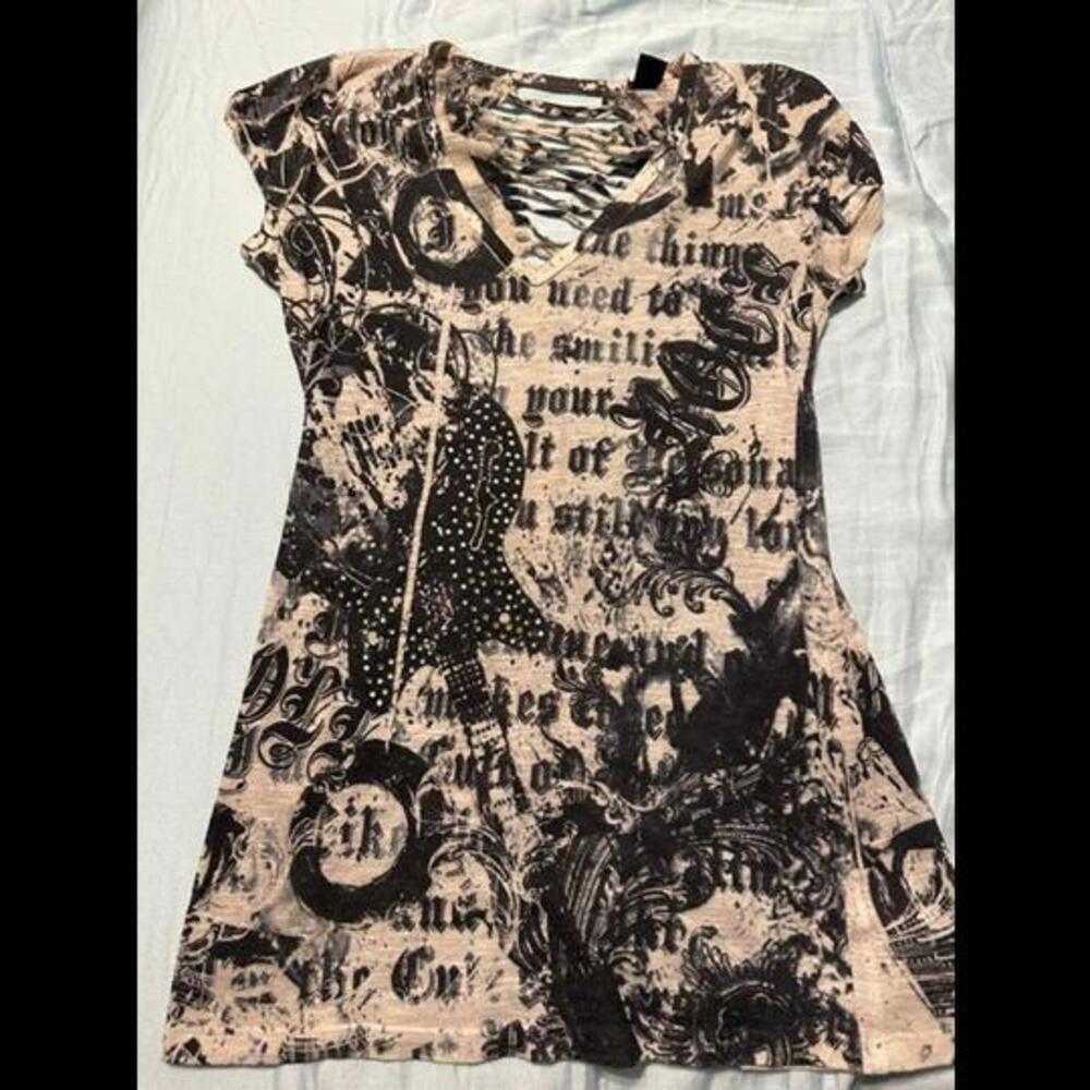 Stand out with this stylish and trendy razor back top